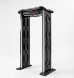 Modern arch walk-through metal detector installed in a professional building entrance for security screening.