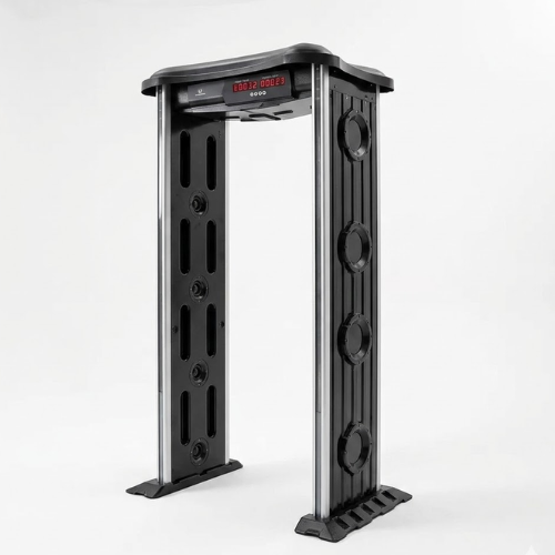 Modern arch walk-through metal detector installed in a professional building entrance for security screening.