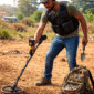 man holding metal detector 85x85