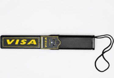 VISA handheld metal detector wand for security screening in Lagos, Nigeria.