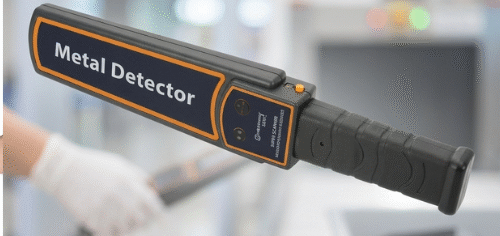 Security officers using affordable handheld metal detectors at an event entrance in Nigeria